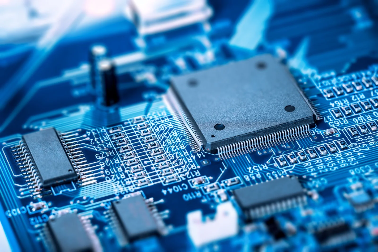A chip on a motherboard showing circuits and connections